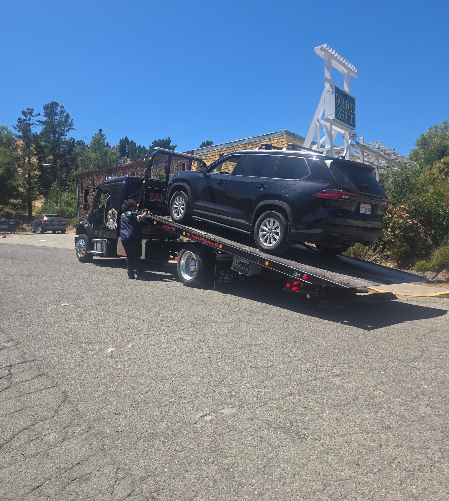 SUV loaded onto an On The Go Towing flatbed